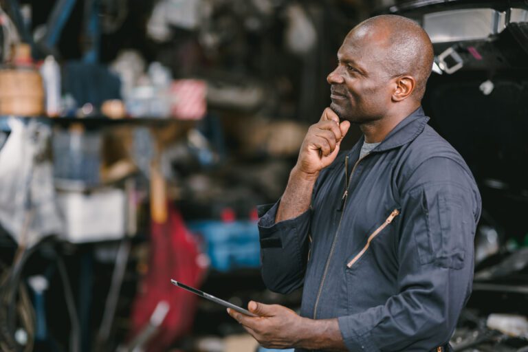A car mechanic thinking about auto repair and maintenance.