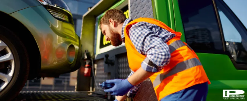 PCC - Man working on towing service on road